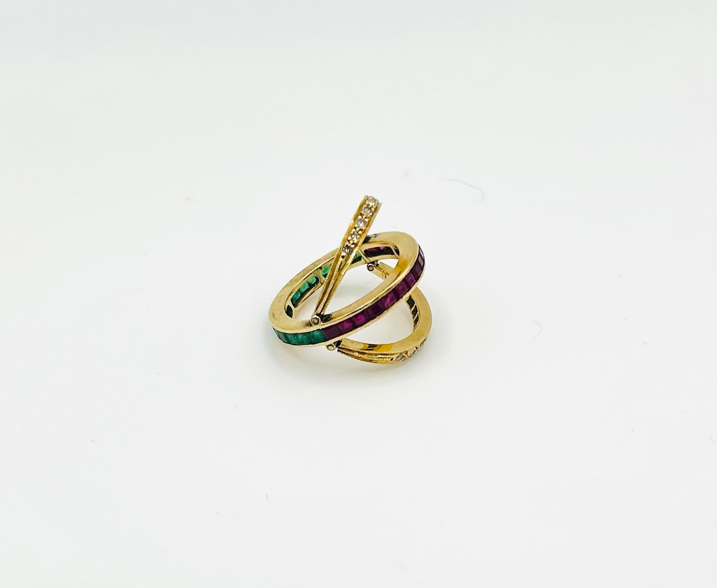 Diamond, ruby & emerald swivel eternity ring set in 18k yellow gold