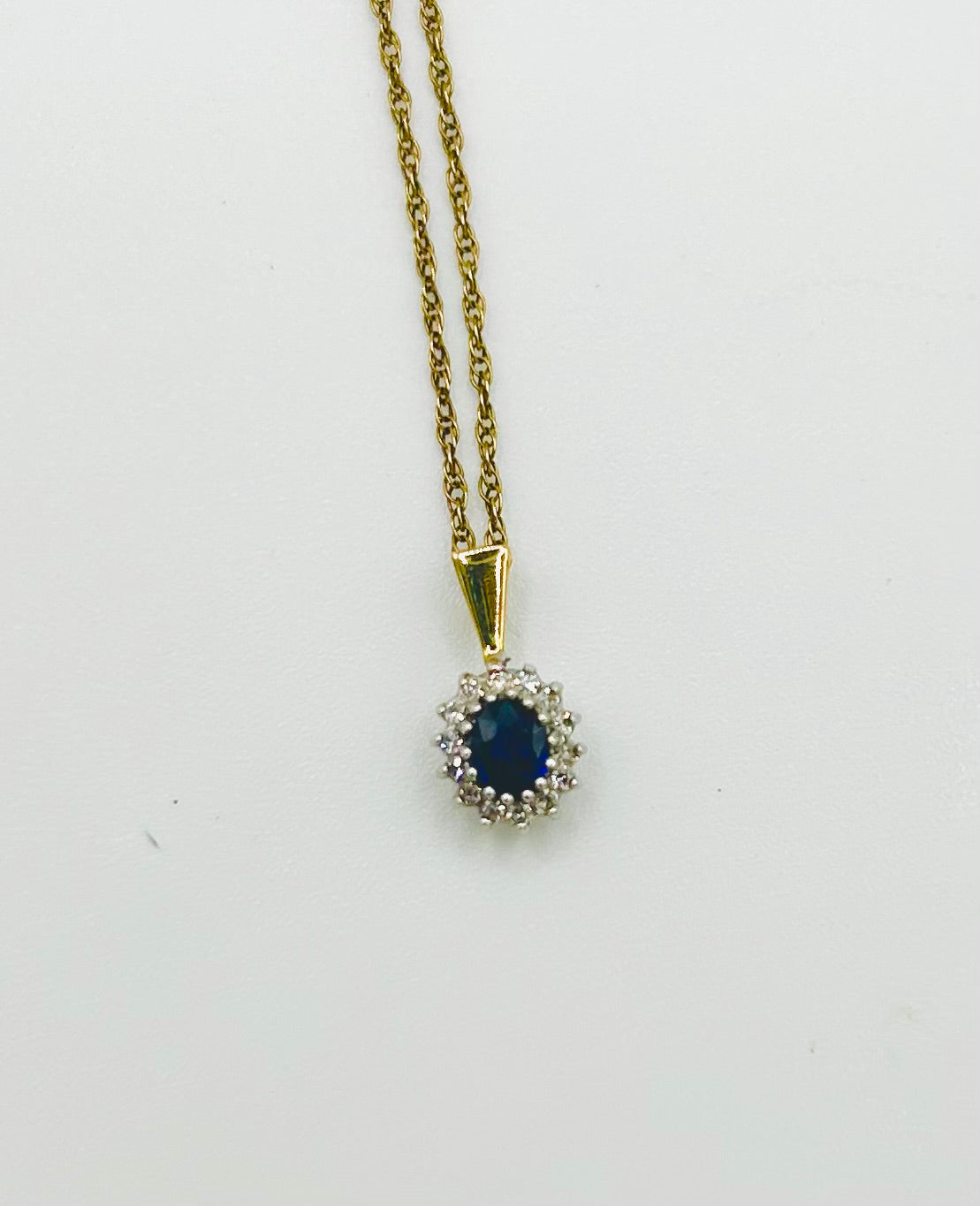 Sapphire & diamond pendant on a gold chain