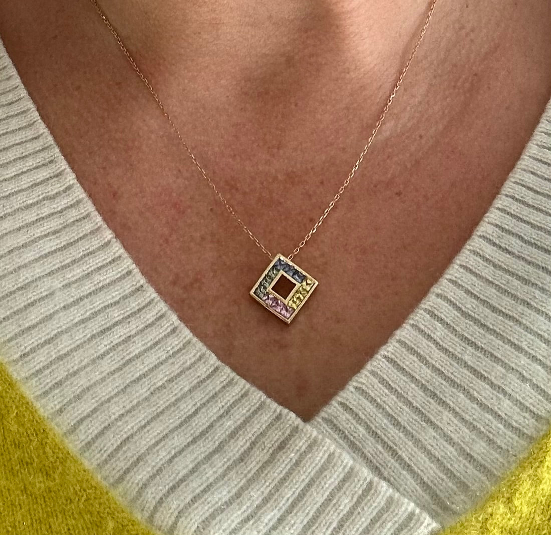 Multi coloured sapphire pendant on gold chain