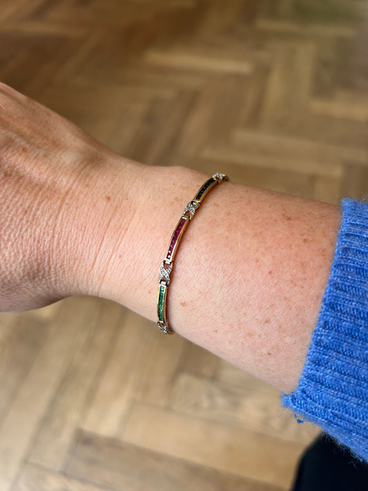 Emerald, sapphire & ruby bracelet set in gold