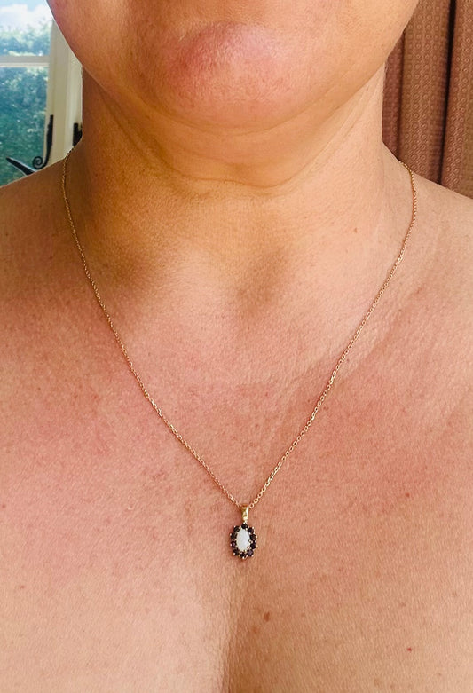 Sapphire and Opal pendant on a gold chain