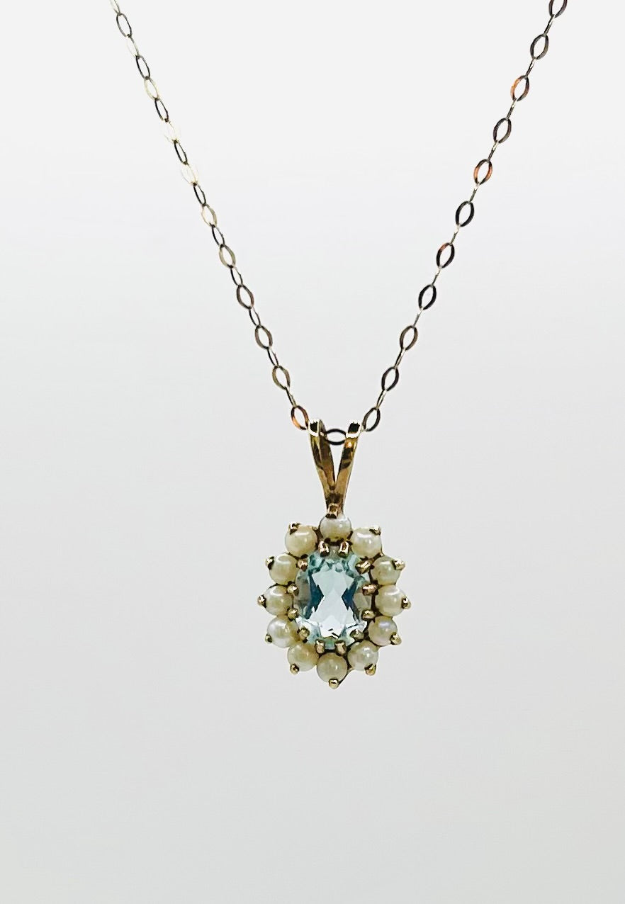 Aquamarine & seed pearl pendant on a gold chain