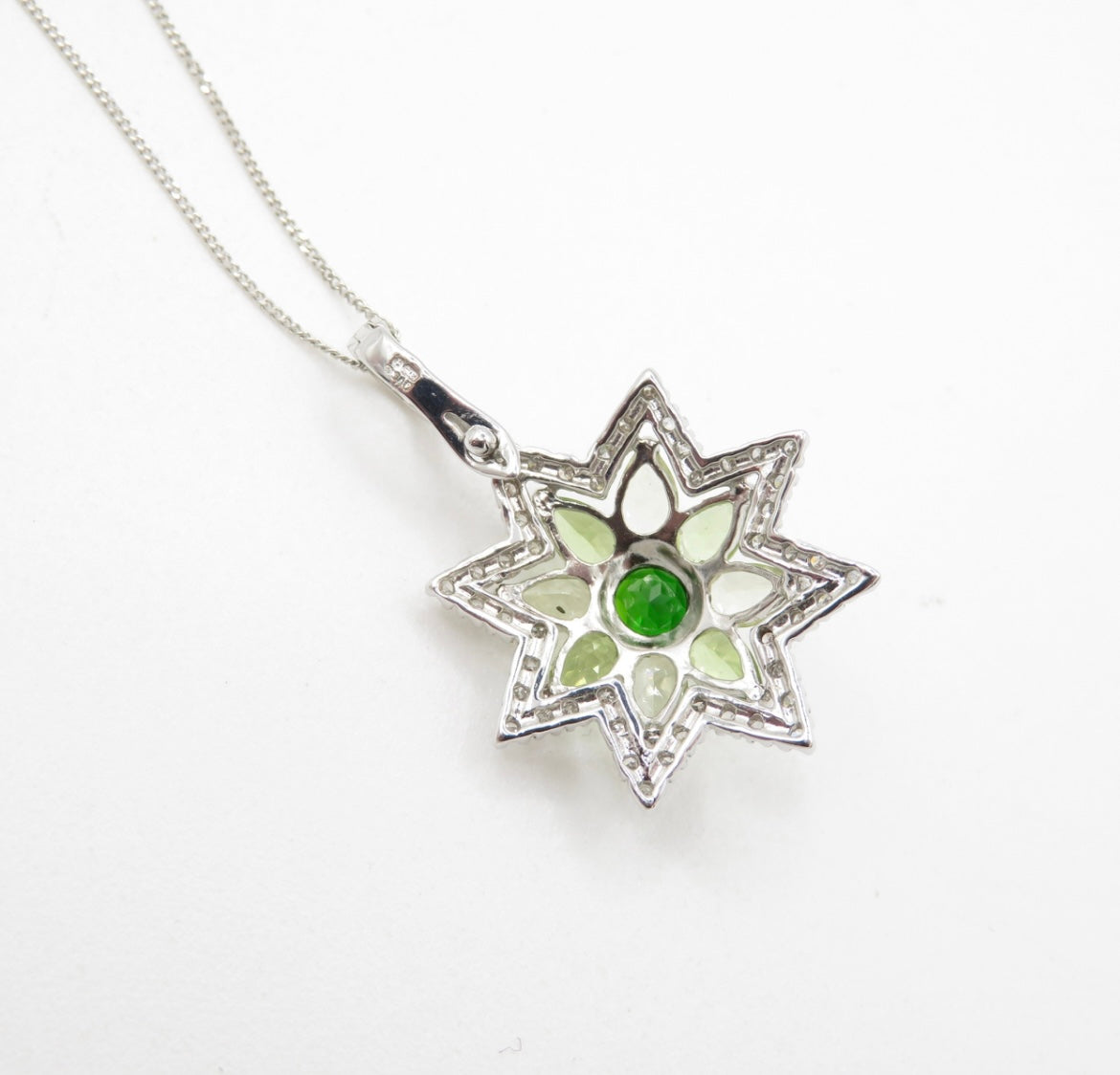 Diamond, peridot & diopside star pendant on a white gold chain