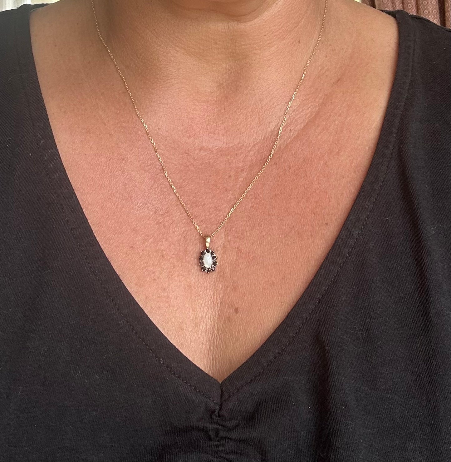 Sapphire and Opal pendant on a gold chain
