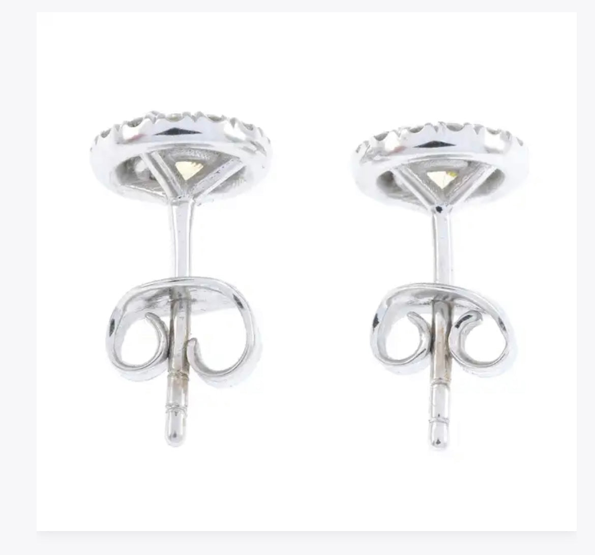 Yellow diamond studs surrounded by brilliant cut diamonds set in 14k white gold