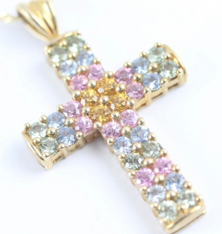 Multi coloured sapphire cross on gold chain