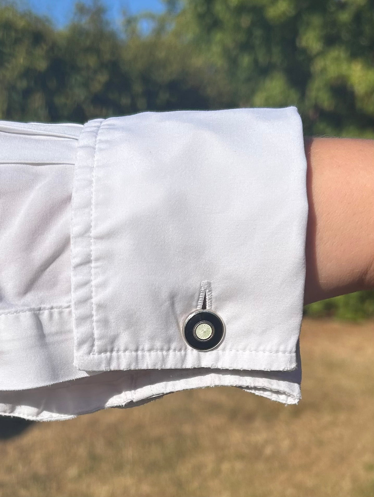 Silver enamel cufflinks with four matching dress studs