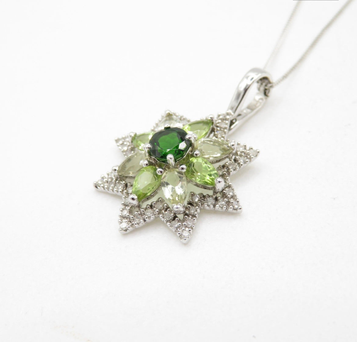 Diamond, peridot & diopside star pendant on a white gold chain