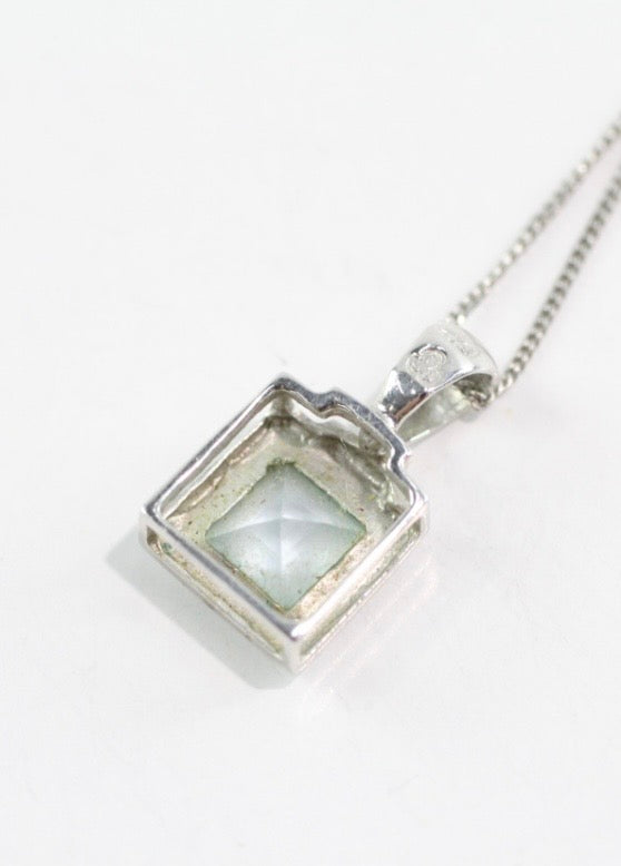 Blue topaz and white gold pendant on a white gold chain