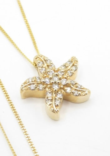 Starfish diamond pendant on 14ct gold chain
