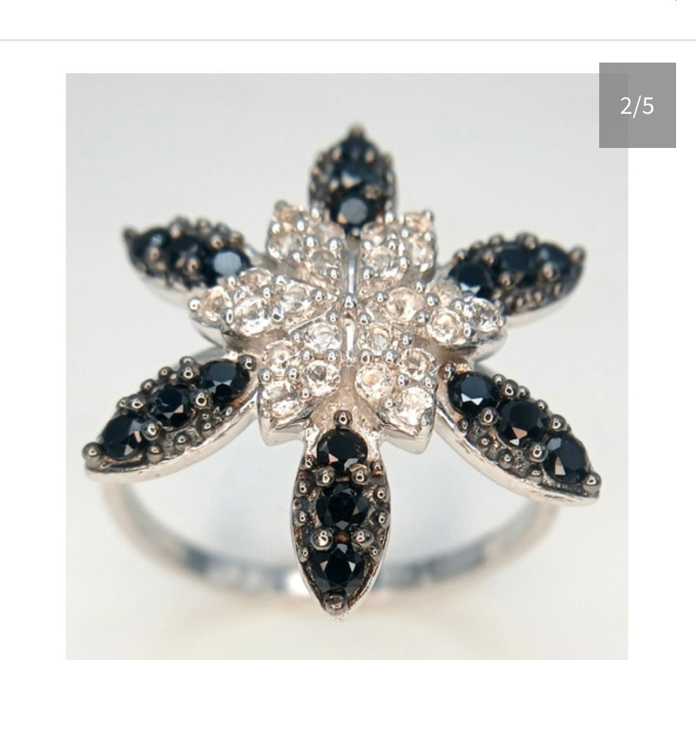 Black onyx and white spinel starburst ring