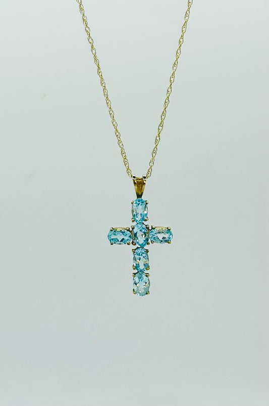 Topaz cross on a gold chain